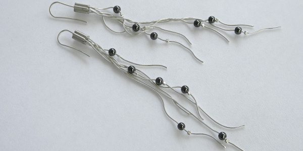 890 - Hematide Long drop earrings On White Silver